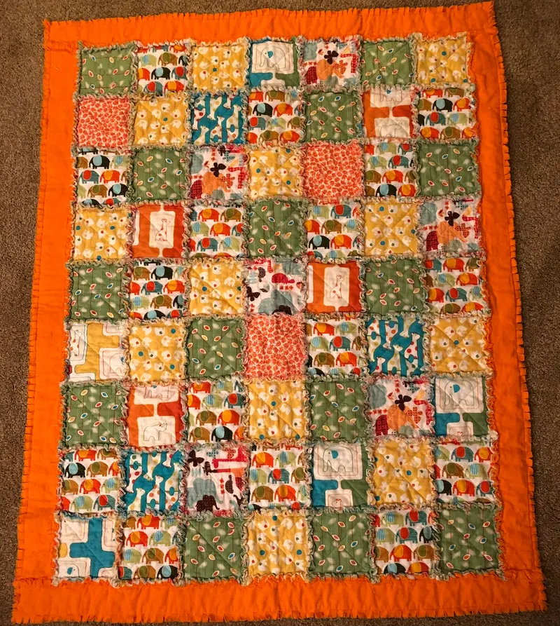 Colorful rag quilt with animal prints in bright colors