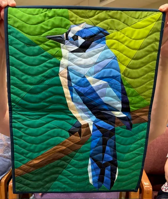 Blue jay bird in blue and teal tones