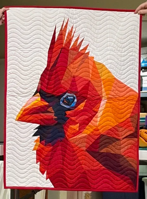 Red cardinal bird portrait in fiery tones
