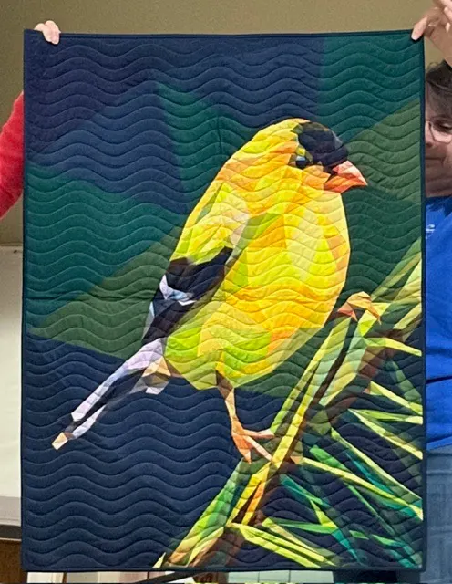 American goldfinch perched on a branch