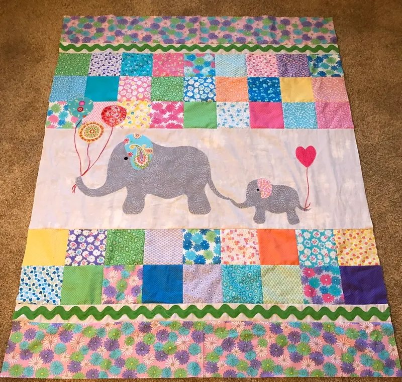 Mama and baby elephant with balloons and heart