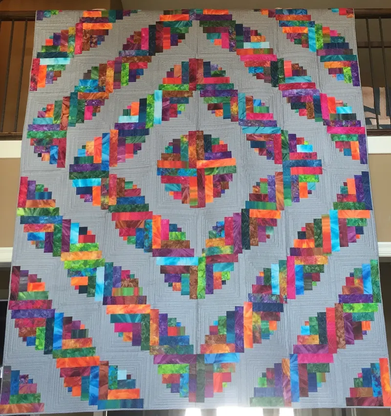 Rainbow log cabin blocks in vivid batik fabrics