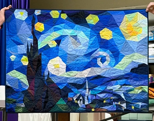Van Gogh Starry Night inspired quilt with swirling blue sky