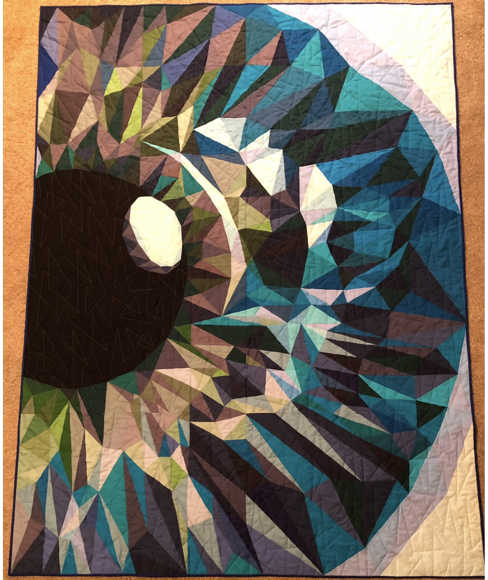 Ammonite nautilus shell spiral in teals and blues