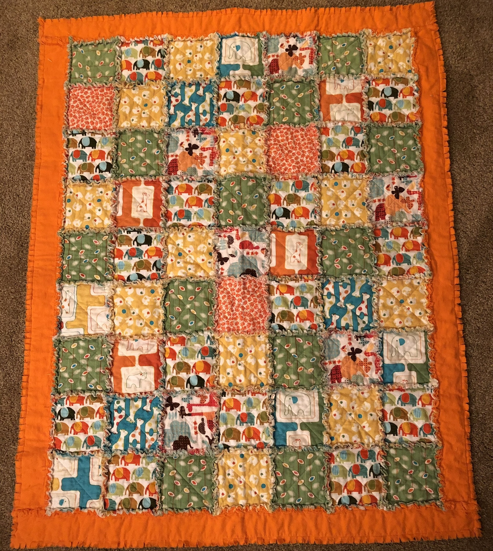 Colorful rag quilt with animal prints in bright colors