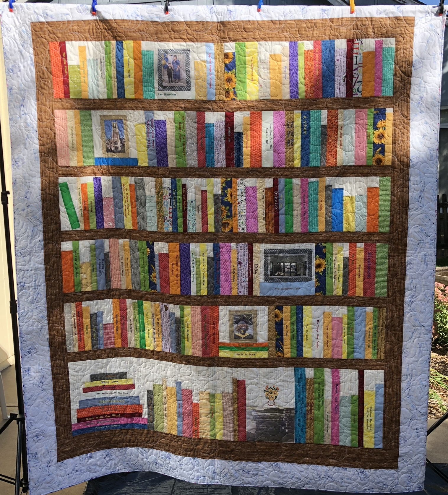 Bookshelf depicting rows of colorful books on shelves