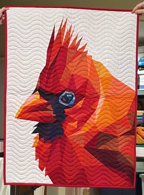 Red cardinal bird portrait in fiery tones