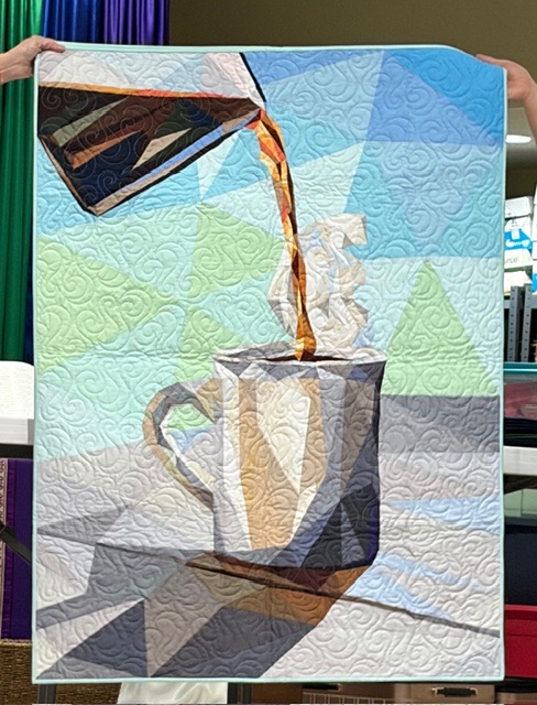 Coffee being poured from carafe into mug with steam