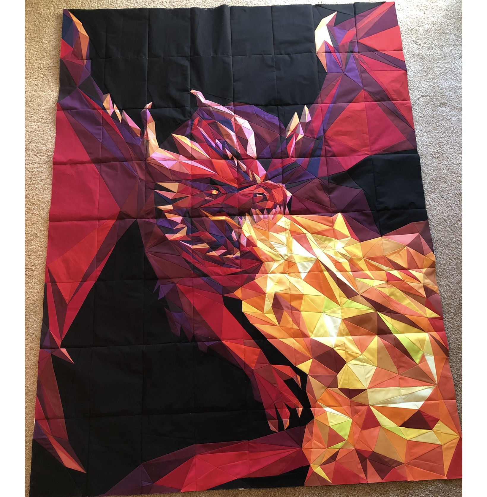 Red and purple dragon breathing golden fire