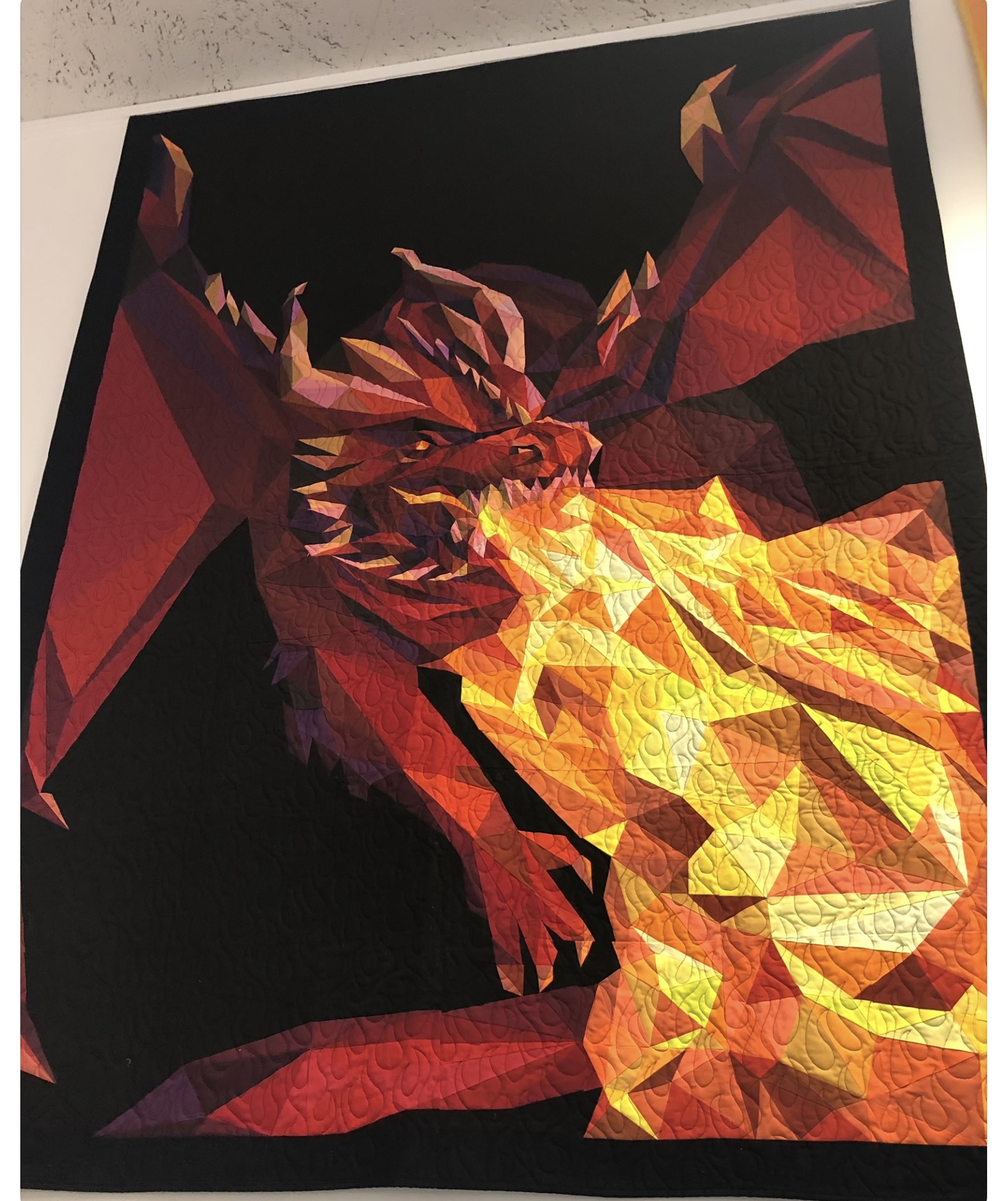 Fire-breathing dragon with wings spread