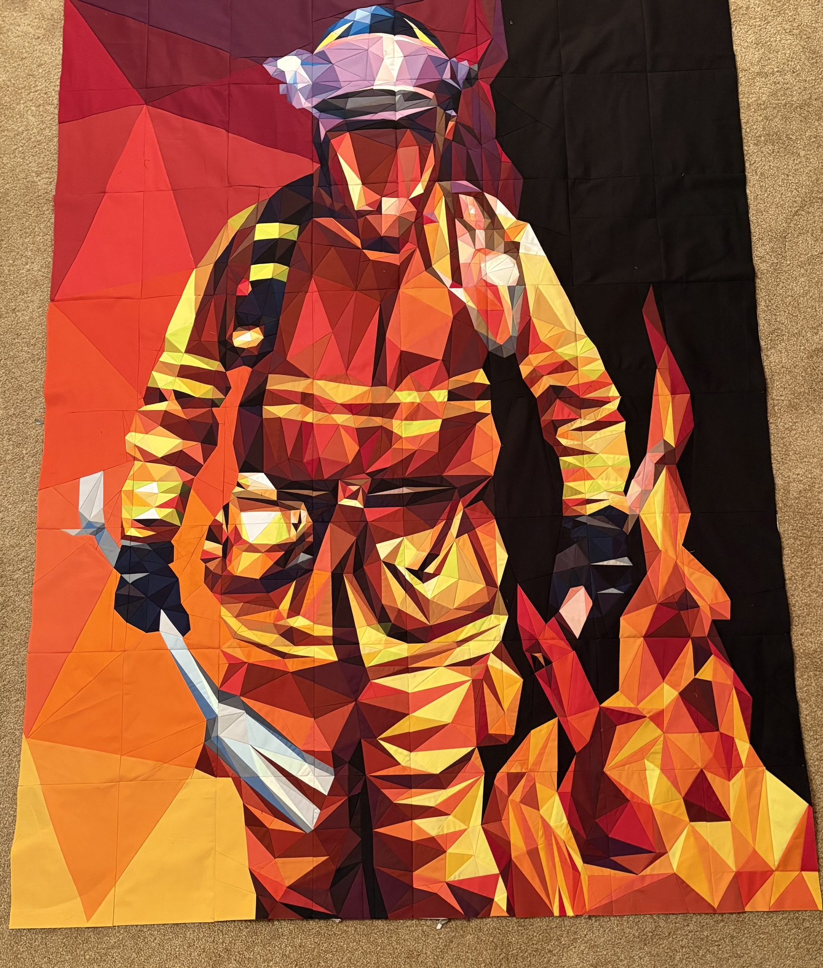 Firefighter in turnout gear walking through flames