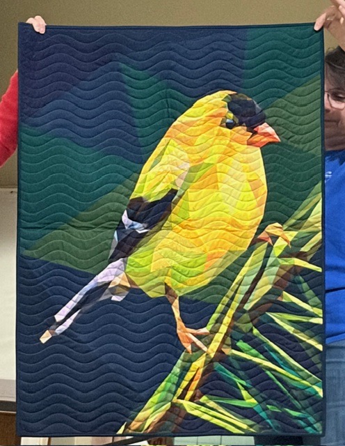 American goldfinch perched on a branch