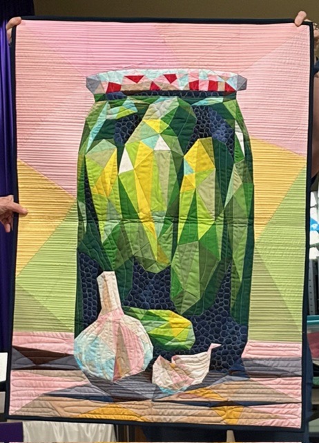 Glass jar of pickles with garlic cloves