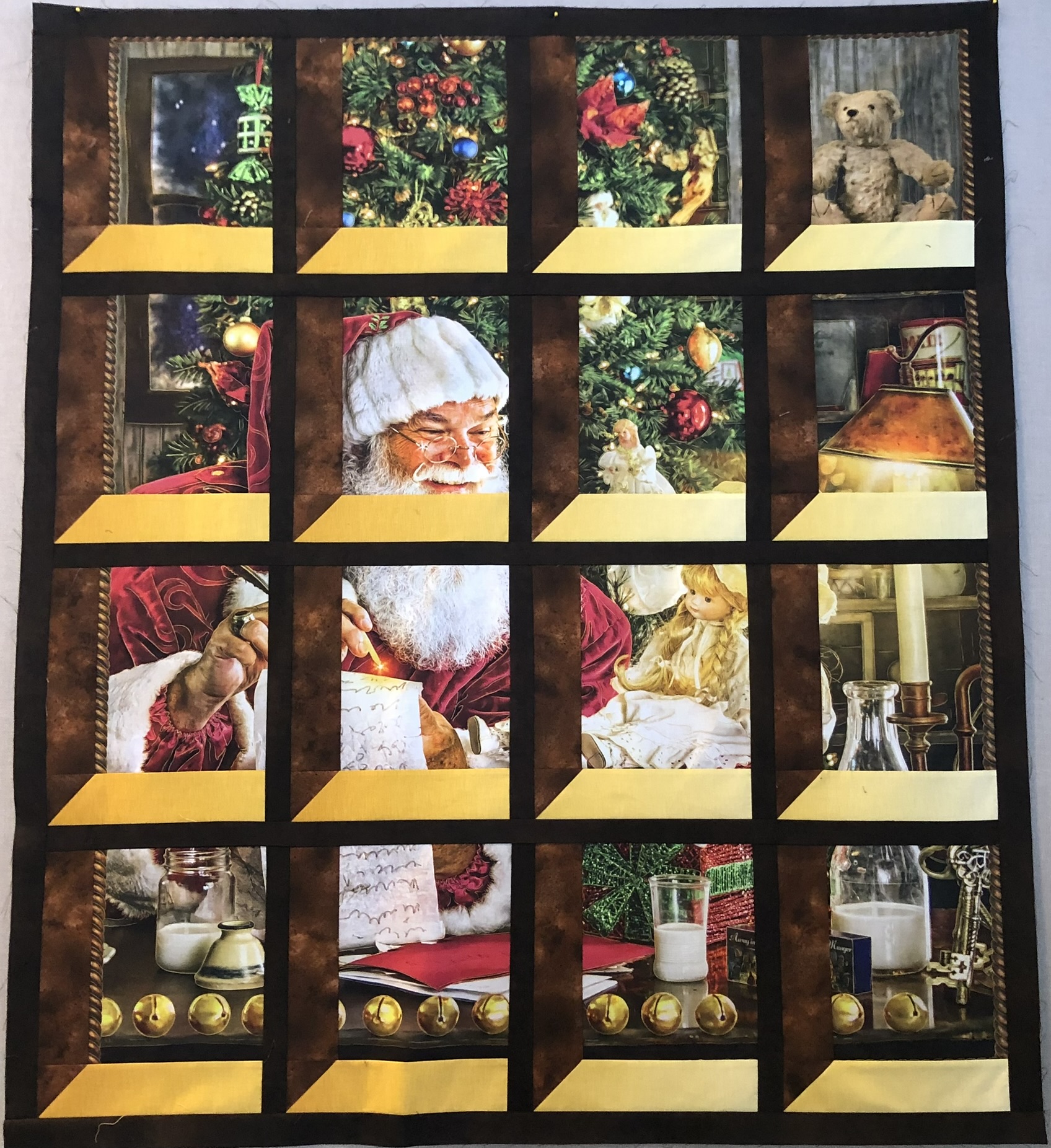 Santa Claus scenes through window panes with gold sash