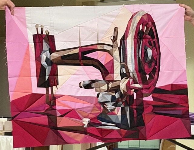 Vintage sewing machine in pink and burgundy tones