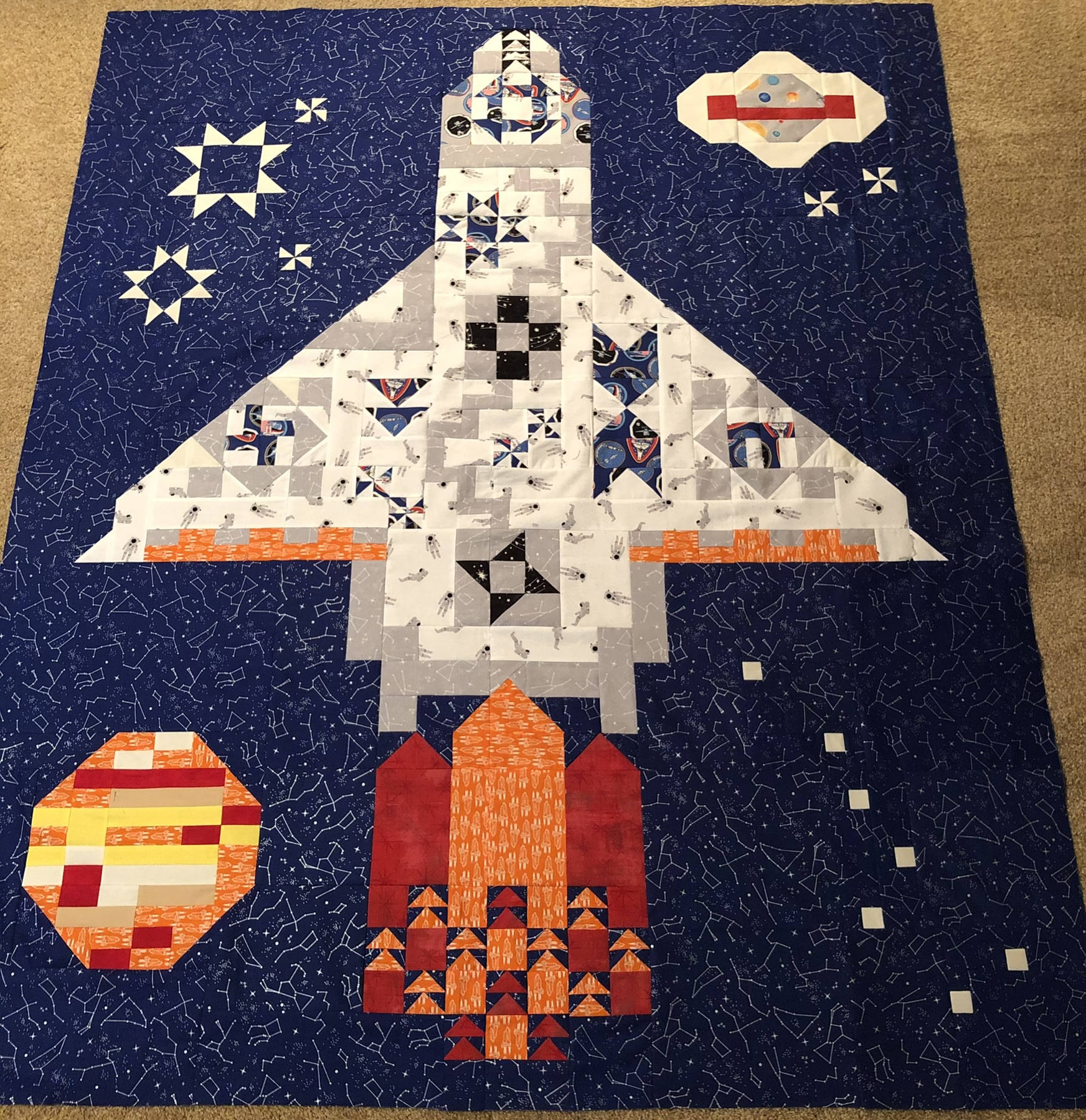 Space shuttle on deep navy blue background with stars